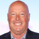 Disney CEO Bob Chapek smiles.
